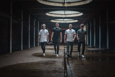 4 creatives walking down a alley wearing creatives club branded clothing